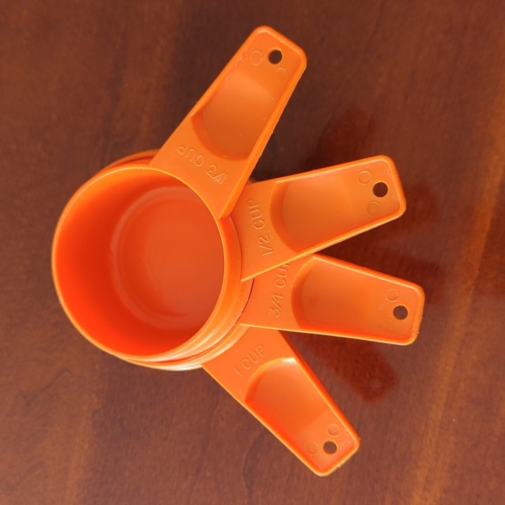 Vintage Tupperware Orange measuring cups-set of four.
